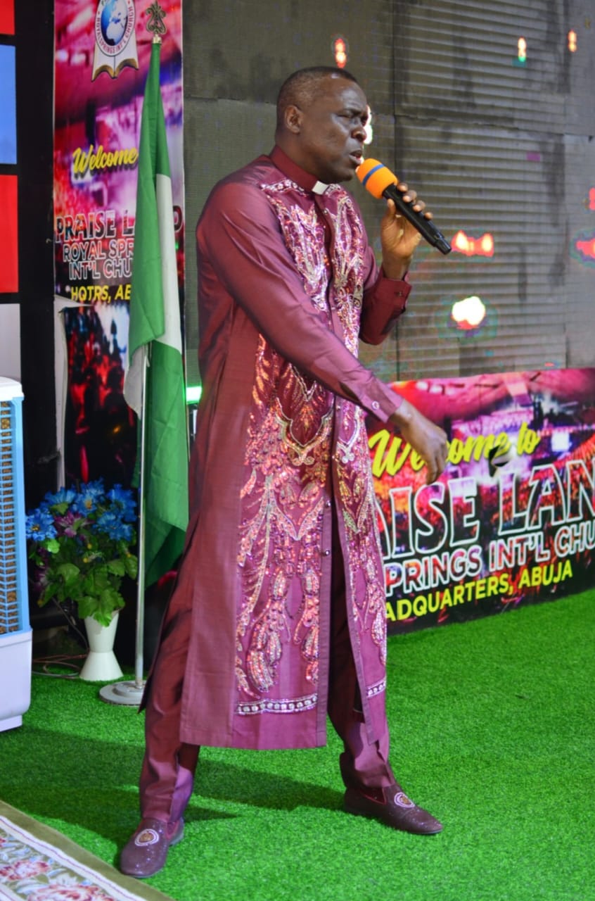 Apostle Prof. E. C. Ejiofor preaching on a church stage